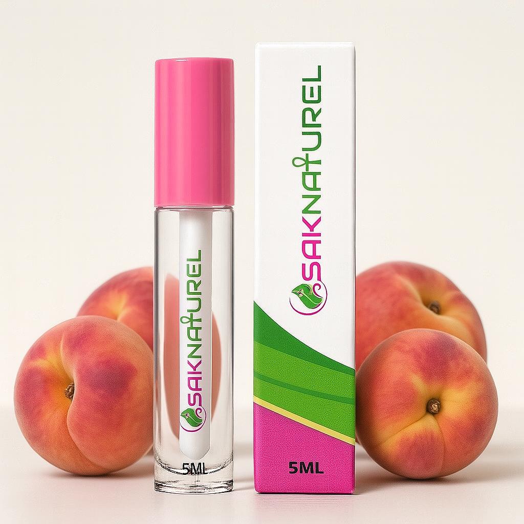 "SakNaturel hydrating peach lip gloss in a clear tube with gold cap, displayed on a white background. Vegan formula with a juicy peach scent for soft, glossy lips."

